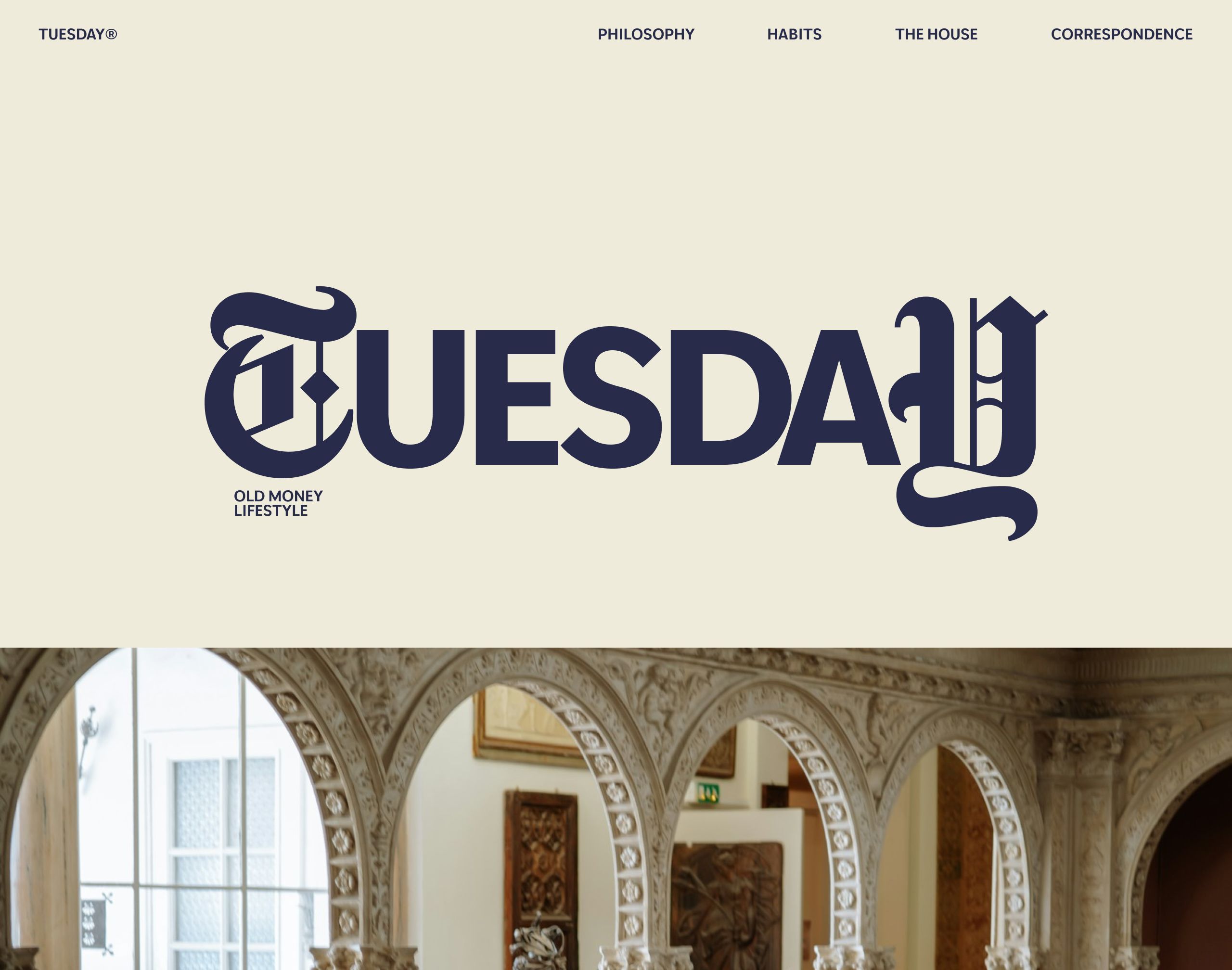 Cream landing page with a large navy blackletter-serif TUESDAY wordmark tagged Old Money Lifestyle, a nav bar, and a photo strip of an ornate carved-arch interior below.
